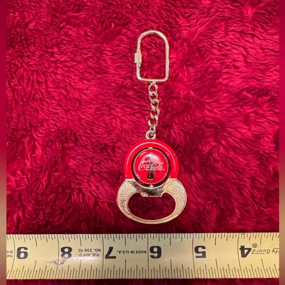 NWOT Vintage Coca Cola Keychain/ Bottle Opener Spinner  In Gold, Red And Yellow.